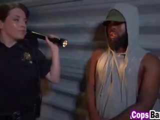 Arrested black guy gets fucked by two female officers